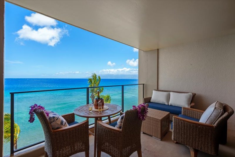 Lanei space with modern lounge seating and beverage table overlooking ocean