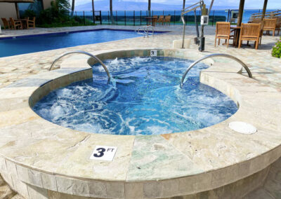The Mahana poolside view of spa and pool water overlooking ocean