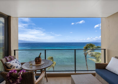 Lanei space with modern lounge seating and beverage table overlooking ocean