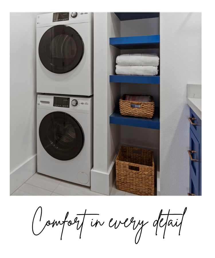 Comfort in every detail White washer and dryer frontloading stack in bathroom with shelves and storage